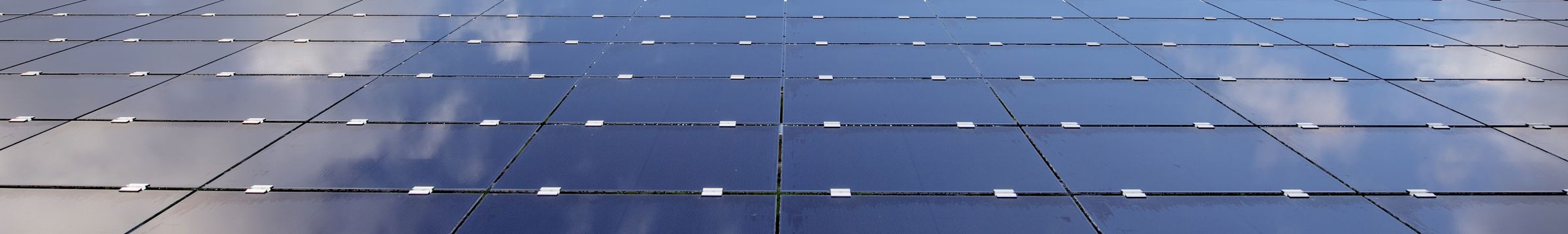 Solar panels reflecting the sky