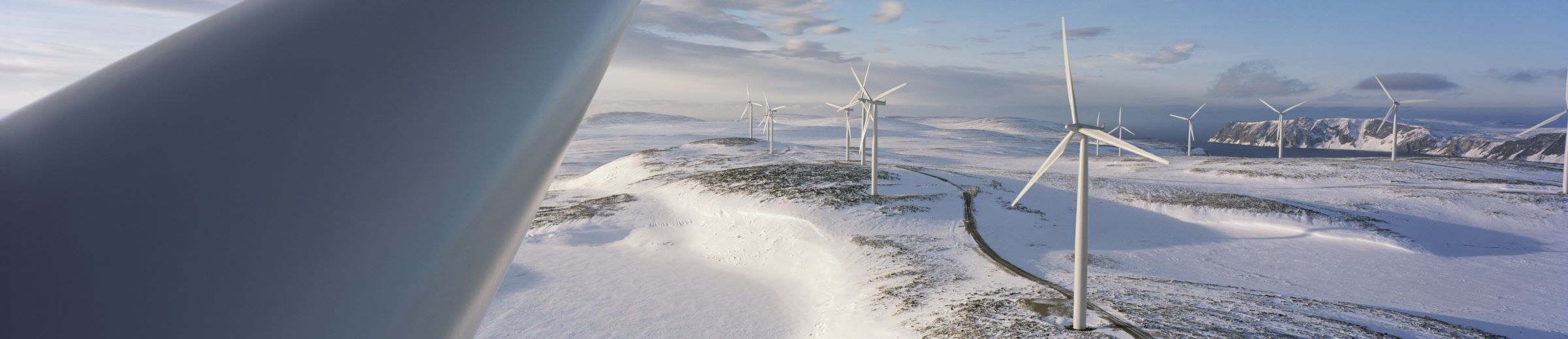 Wind turbine in snow-covered landscape