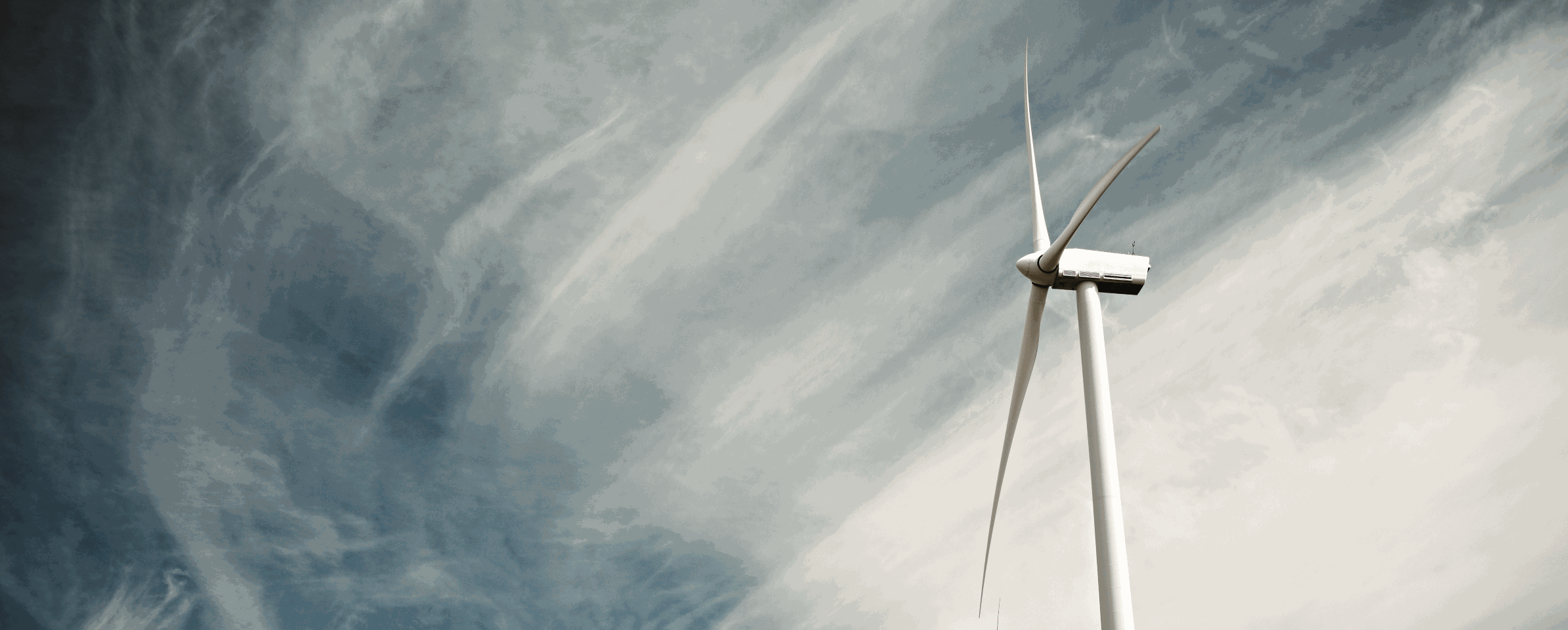 Wind turbine against sky