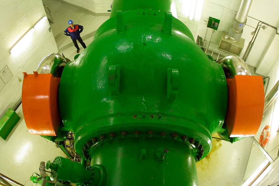 Ball valve regulating water flow into turbine at Sima power plant.