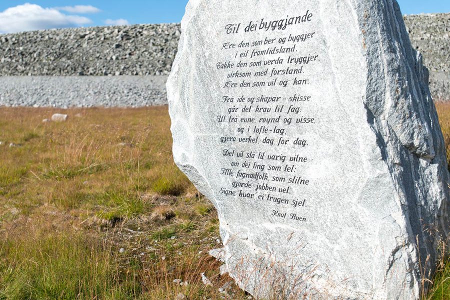 Stone block at Songa dam engraved with a poem by artist and musician Knut Buen.