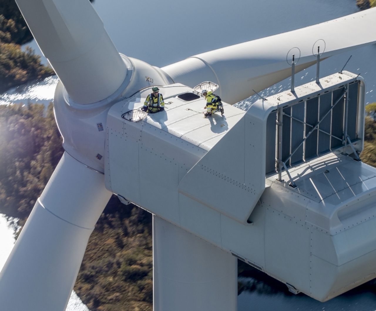 People working on top of wind turbine