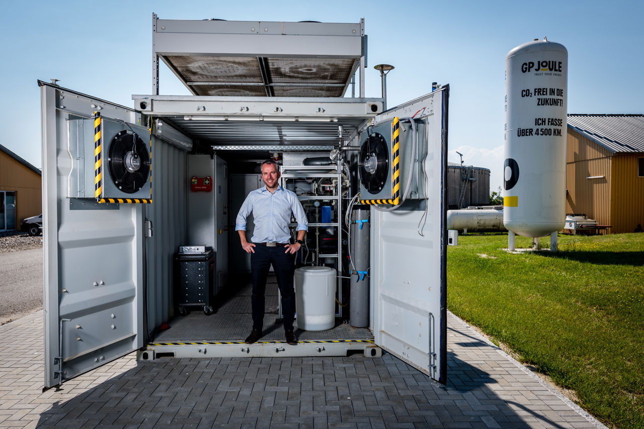 A man standing in a battery tank