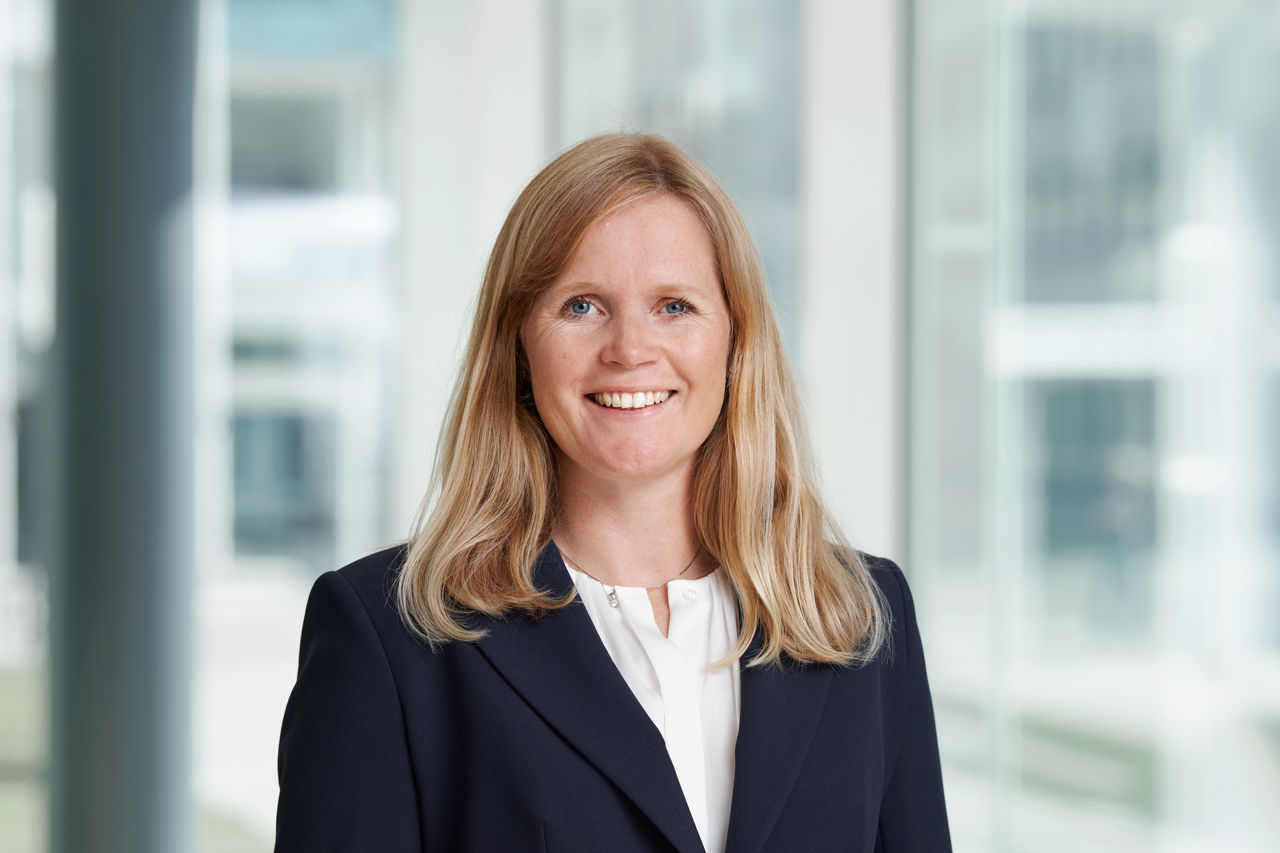 Woman in suit smiling