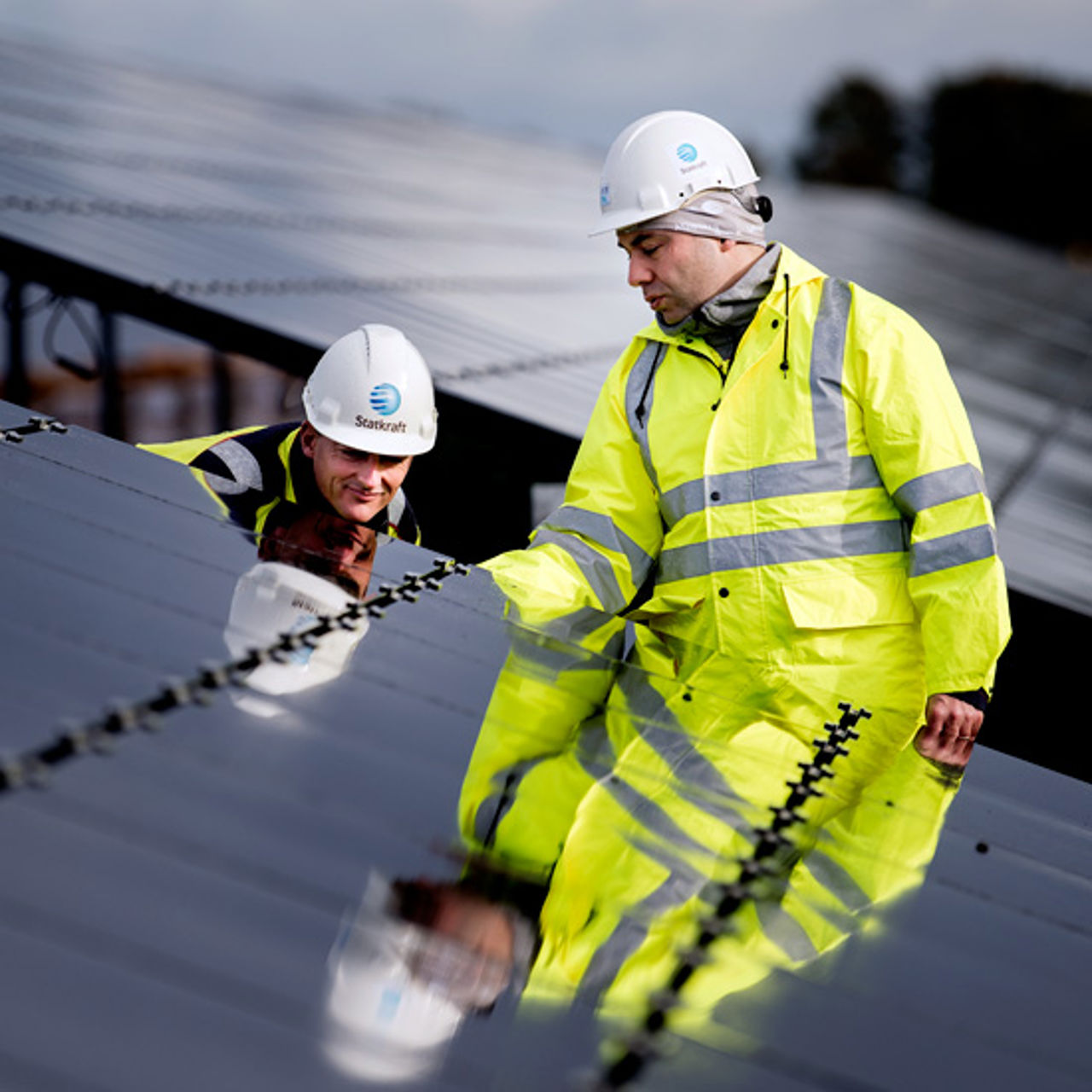 Two men working on solar panels