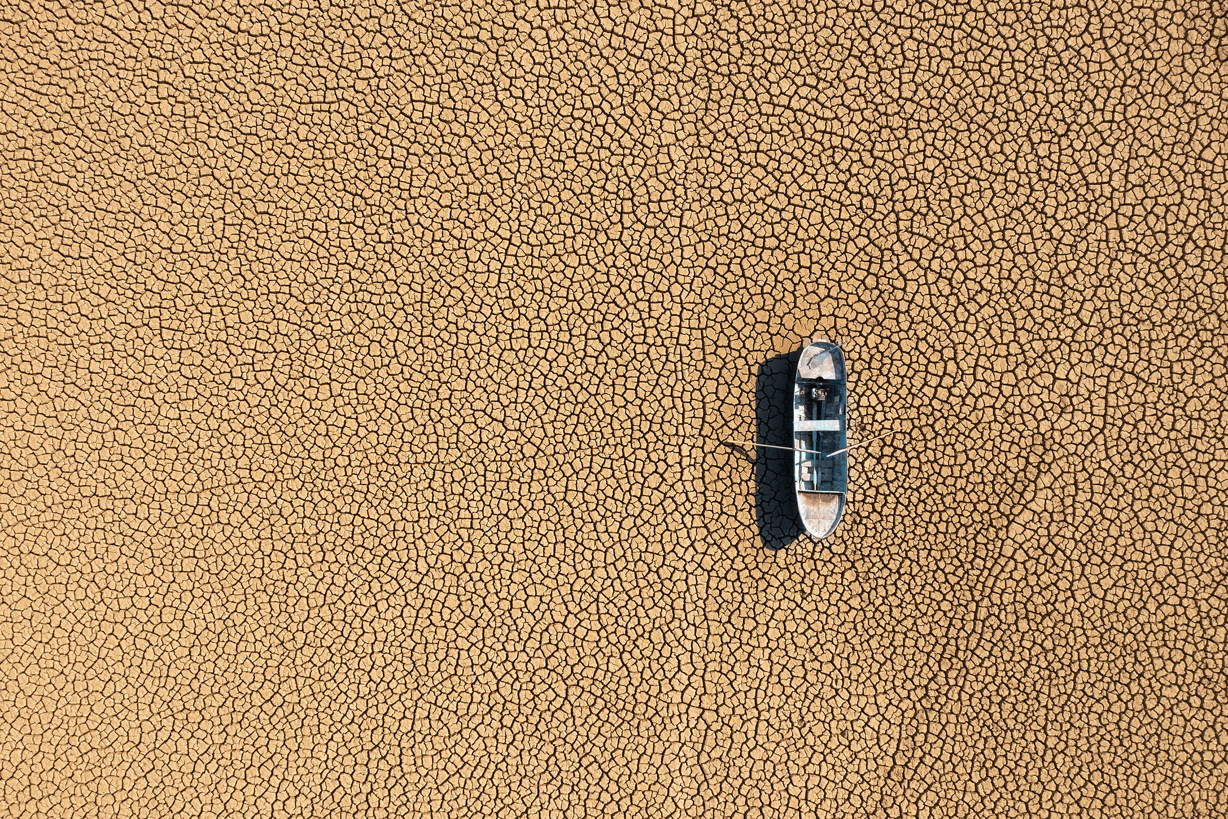 Boat strande on a dried-out lake