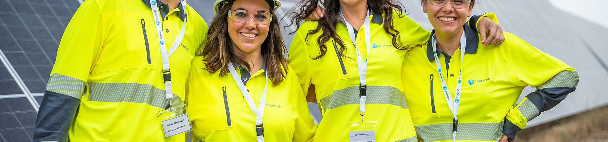 four people in yellow