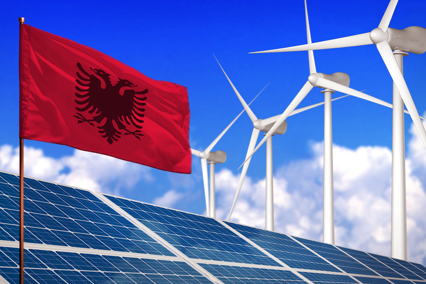 Albania's flag with solar panels and wind turbines in the background
