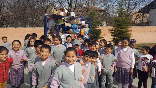Children in front of waste bin