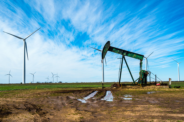 Wind turbines and an old oil rig